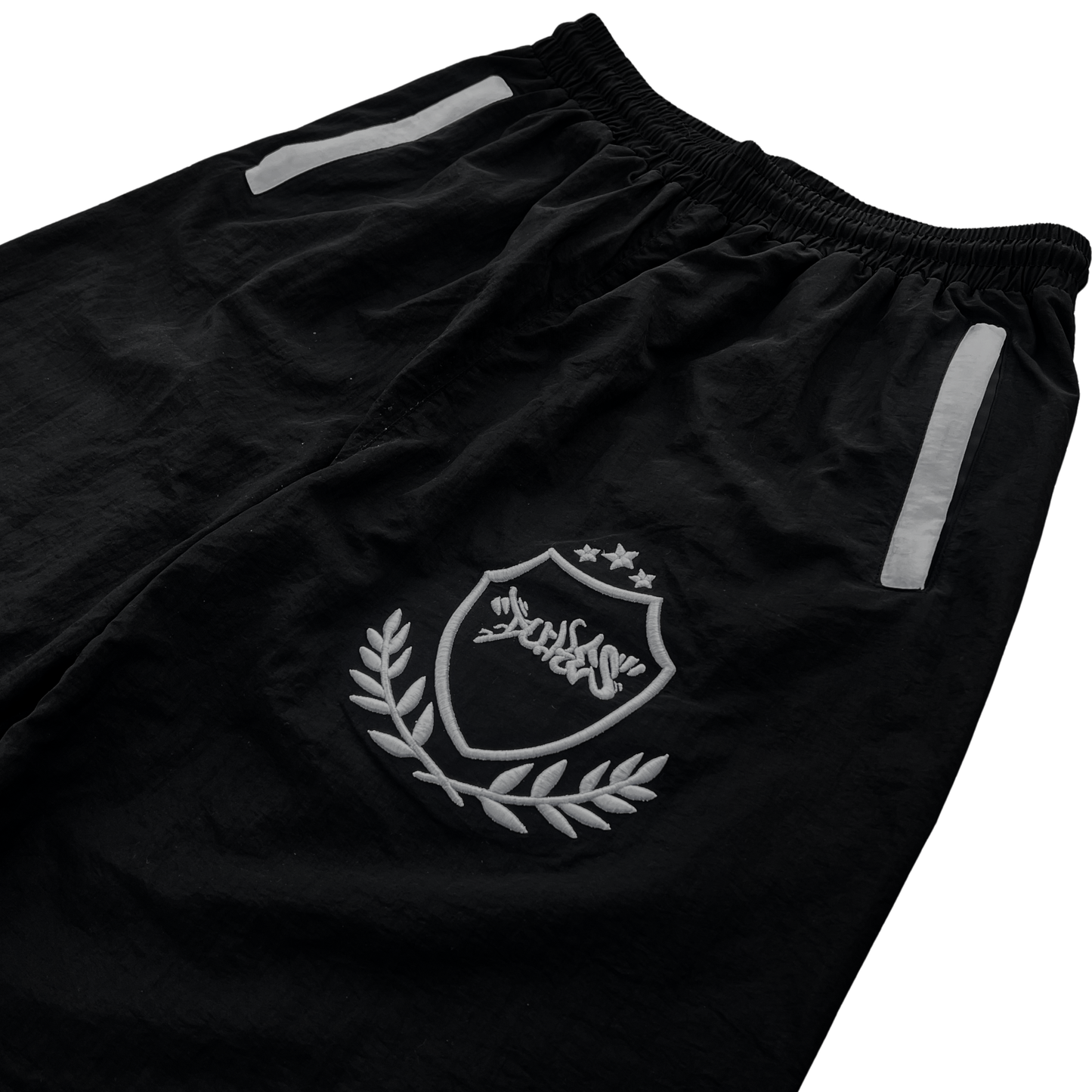 dukes trackpants logo close up